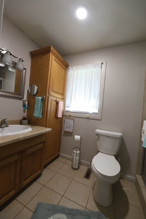 602 Centennial Ave, West Fork, AR 72774 - full bathroom with toilet, a shower, baseboards, tile patterned flooring, and vanity
