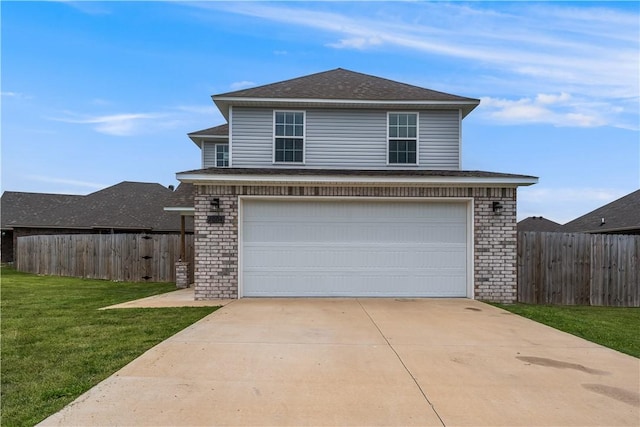 view of front facade featuring a front yard, driveway, brick siding, and fence