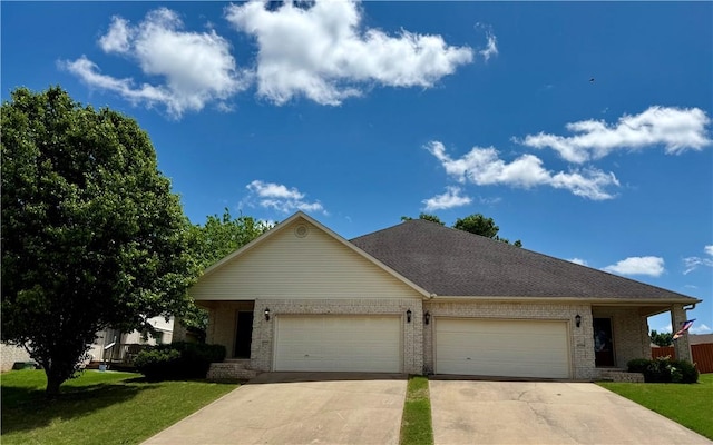 6297/6299 W Milliken Bnd, Fayetteville, AR 72704 - view of front facade featuring a garage, a front lawn, brick siding, and driveway
