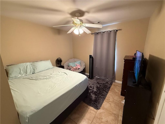 6297/6299 W Milliken Bnd, Fayetteville, AR 72704 - bedroom with a ceiling fan and light tile patterned flooring