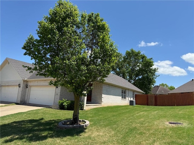 6297/6299 W Milliken Bnd, Fayetteville, AR 72704 - exterior space with a lawn, brick siding, a garage, and fence