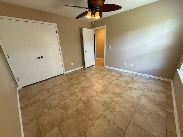 6297/6299 W Milliken Bnd, Fayetteville, AR 72704 - unfurnished bedroom featuring a closet, baseboards, and a ceiling fan