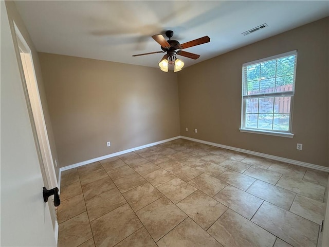 6297/6299 W Milliken Bnd, Fayetteville, AR 72704 - empty room with light tile patterned flooring, baseboards, a ceiling fan, and visible vents
