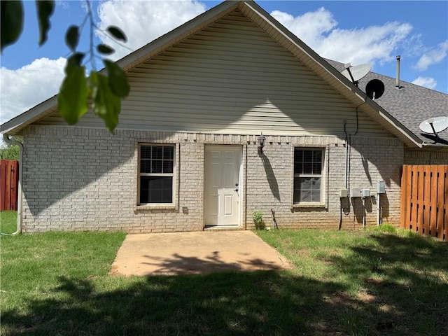 6297/6299 W Milliken Bnd, Fayetteville, AR 72704 - back of house with a lawn, a patio, brick siding, and fence