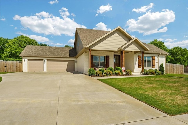142 N Sheep Dog Ave, Farmington, AR 72730 - craftsman-style home with an attached garage, fence, concrete driveway, a front lawn, and brick siding