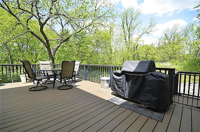 42 Sable Dr, Bella Vista, AR 72715 - wooden terrace with grilling area and outdoor dining area