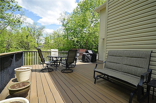 42 Sable Dr, Bella Vista, AR 72715 - wooden deck featuring outdoor dining area