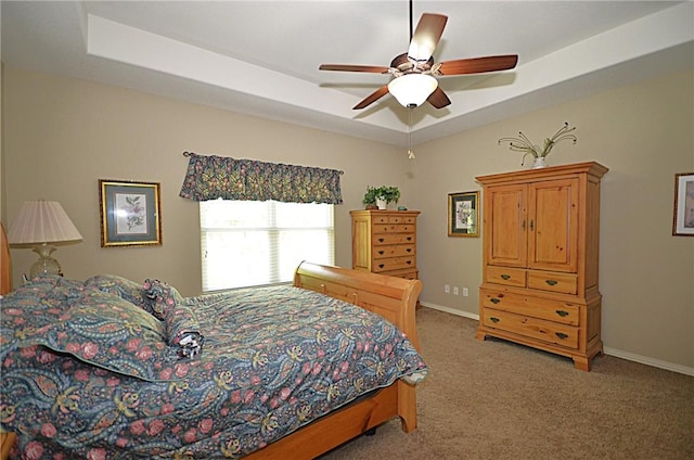 42 Sable Dr, Bella Vista, AR 72715 - bedroom featuring baseboards, a raised ceiling, a ceiling fan, and light colored carpet