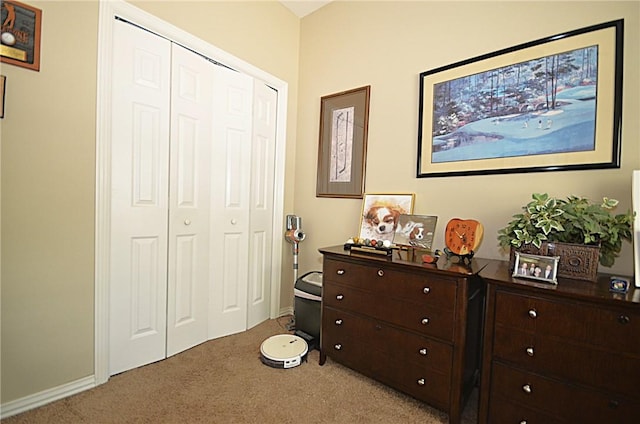 42 Sable Dr, Bella Vista, AR 72715 - bedroom with light colored carpet, a closet, and baseboards