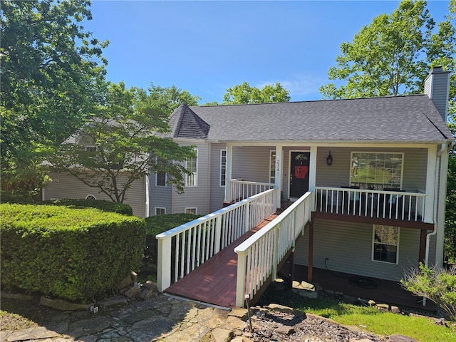 2341 N Fox Trl, Fayetteville, AR 72703 - bungalow-style house featuring a chimney, a porch, roof with shingles, and stairway