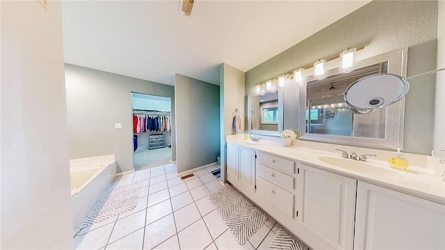 2341 N Fox Trl, Fayetteville, AR 72703 - full bath with a sink, tile patterned floors, double vanity, baseboards, and a bath