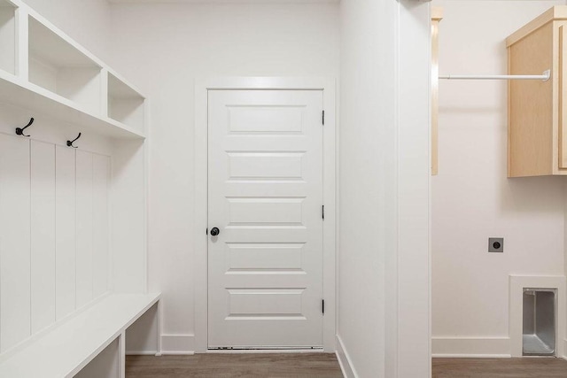 mudroom featuring wood finished floors and baseboards