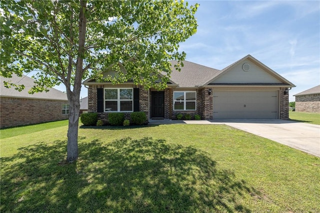 2300 Double Bogey Ln, Farmington, AR 72730 - view of front facade with a front lawn, driveway, brick siding, and an attached garage