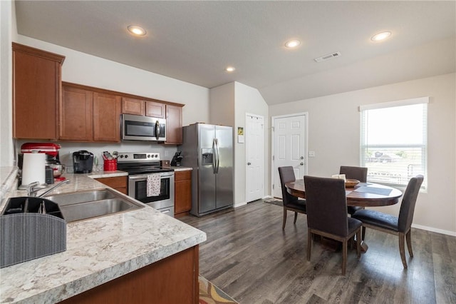 2300 Double Bogey Ln, Farmington, AR 72730 - kitchen with a sink, stainless steel appliances, visible vents, light countertops, and dark wood-style floors