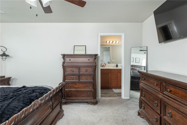 2300 Double Bogey Ln, Farmington, AR 72730 - bedroom featuring connected bathroom, light carpet, and ceiling fan