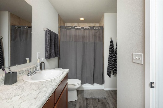2300 Double Bogey Ln, Farmington, AR 72730 - bathroom featuring vanity, curtained shower, toilet, and wood finished floors