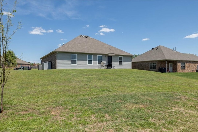 2300 Double Bogey Ln, Farmington, AR 72730 - rear view of property with a yard