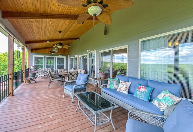 wooden deck with outdoor dining space, a ceiling fan, and an outdoor living space