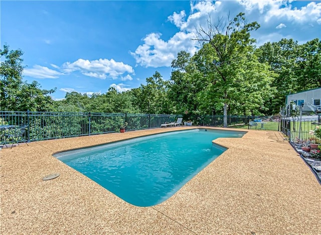 view of swimming pool with a fenced in pool and a fenced backyard