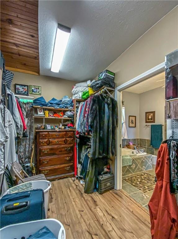 spacious closet with wood finished floors
