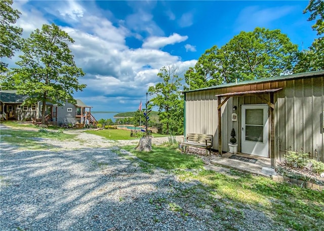 view of yard with an outbuilding and a swimming pool