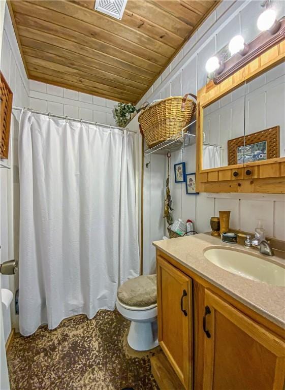 bathroom featuring vanity, wooden ceiling, curtained shower, and toilet