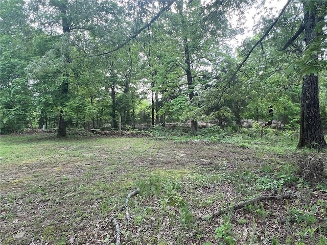 view of landscape with a forest view
