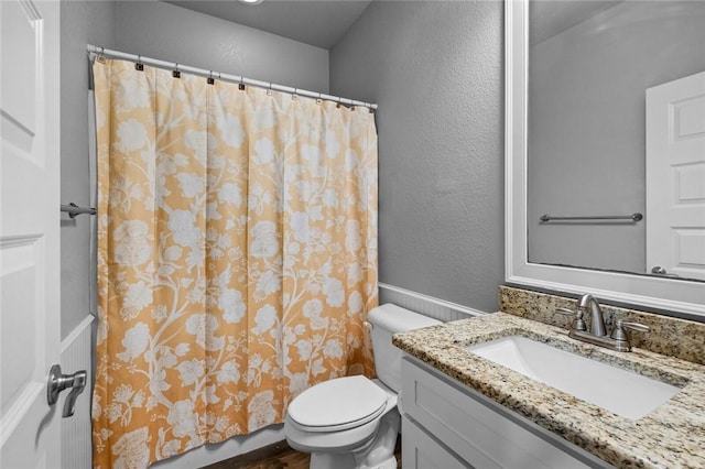 252 Forza Ln, Tontitown, AR 72762 - full bath with a textured wall, toilet, vanity, and a shower with curtain
