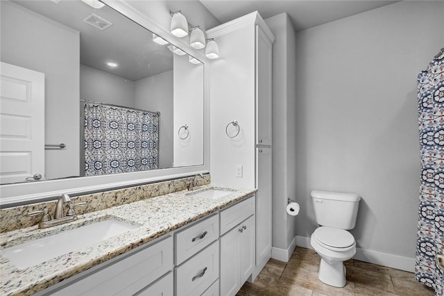 252 Forza Ln, Tontitown, AR 72762 - bathroom with a sink, toilet, baseboards, and visible vents