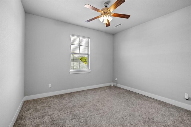 252 Forza Ln, Tontitown, AR 72762 - empty room with a ceiling fan, baseboards, visible vents, and carpet
