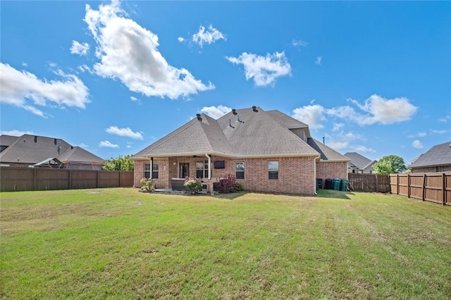 252 Forza Ln, Tontitown, AR 72762 - rear view of property with a yard, brick siding, a fenced backyard, and a patio