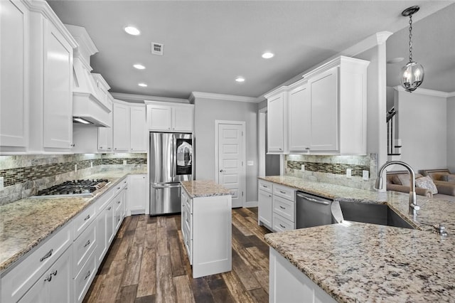 252 Forza Ln, Tontitown, AR 72762 - kitchen with a sink, ornamental molding, light stone counters, white cabinets, and appliances with stainless steel finishes