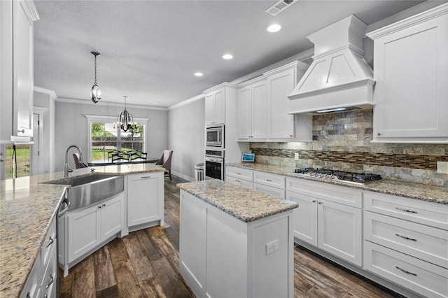 252 Forza Ln, Tontitown, AR 72762 - kitchen with a sink, stainless steel appliances, white cabinets, crown molding, and custom range hood