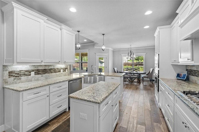252 Forza Ln, Tontitown, AR 72762 - kitchen with plenty of natural light, ornamental molding, a sink, a peninsula, and white cabinets
