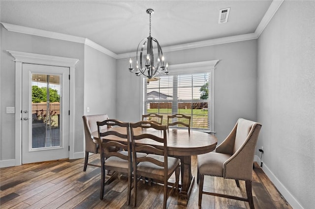 252 Forza Ln, Tontitown, AR 72762 - dining room featuring dark wood-style flooring, a notable chandelier, and plenty of natural light