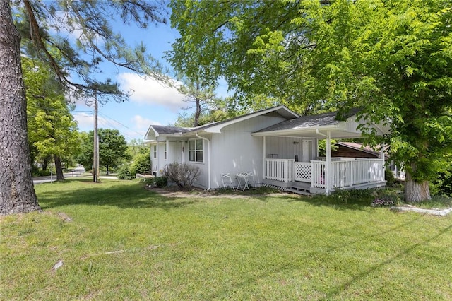 exterior space with a lawn and covered porch