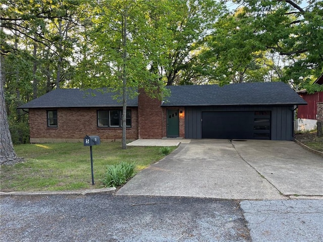 single story home with a chimney, board and batten siding, a garage, concrete driveway, and a front lawn