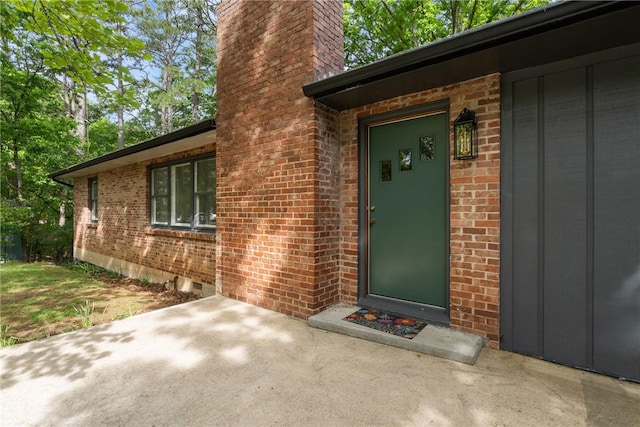 5 College St, Eureka Springs, AR 72632 - entrance to property featuring a chimney and brick siding