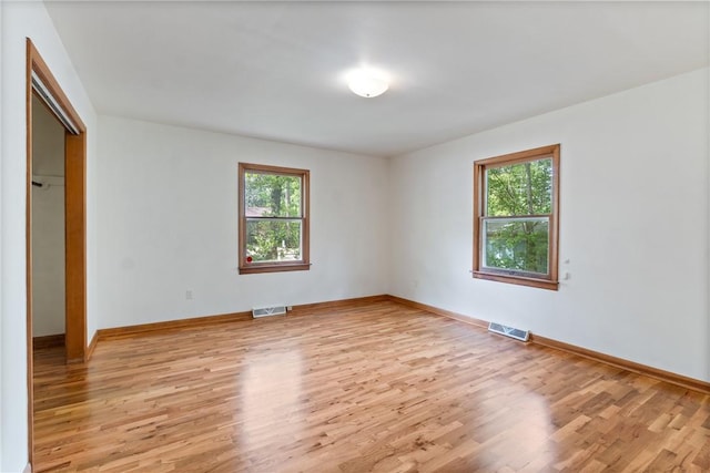 5 College St, Eureka Springs, AR 72632 - unfurnished bedroom with light wood-type flooring, baseboards, and a closet