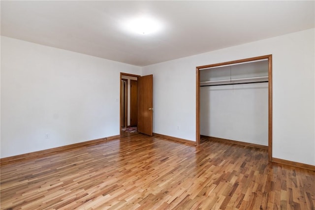 5 College St, Eureka Springs, AR 72632 - unfurnished bedroom featuring light wood-style floors, baseboards, and a closet
