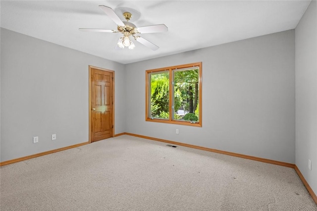 4 Tisbury Ln, Bella Vista, AR 72715 - empty room with baseboards, light colored carpet, and a ceiling fan