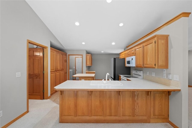 4 Tisbury Ln, Bella Vista, AR 72715 - kitchen with white appliances, a sink, a peninsula, light carpet, and recessed lighting