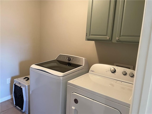 814 Irelan St, Lowell, AR 72745 - laundry area with cabinet space, washing machine and dryer, and tile patterned floors