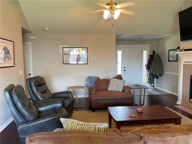 814 Irelan St, Lowell, AR 72745 - living room with baseboards, lofted ceiling, a fireplace, and a ceiling fan