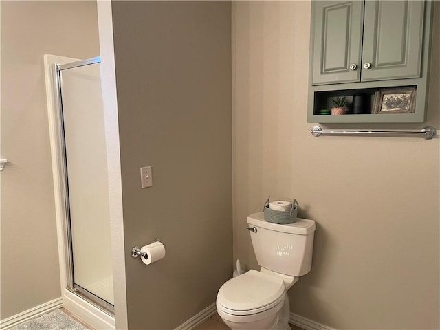 814 Irelan St, Lowell, AR 72745 - full bathroom featuring toilet, baseboards, and a shower stall