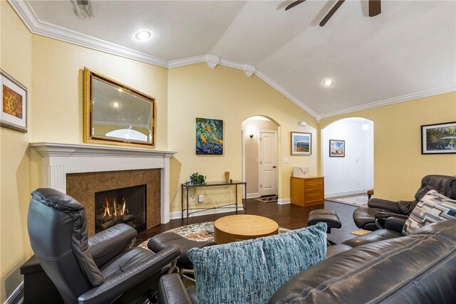8 Eddy Ln, Bella Vista, AR 72715 - living room featuring arched walkways, lofted ceiling, a ceiling fan, dark wood-style flooring, and ornamental molding