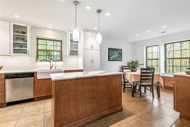 8 Eddy Ln, Bella Vista, AR 72715 - kitchen with stainless steel dishwasher, a sink, plenty of natural light, light countertops, and recessed lighting
