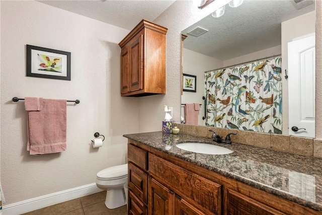 8 Eddy Ln, Bella Vista, AR 72715 - full bath featuring tile patterned flooring, toilet, vanity, a textured ceiling, and baseboards