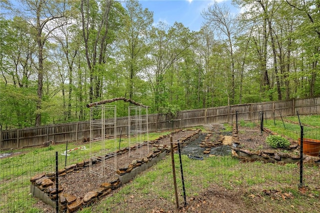 8 Eddy Ln, Bella Vista, AR 72715 - fenced backyard with a garden