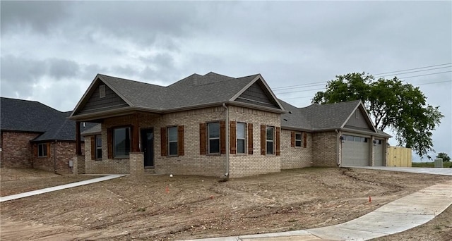 2000 Dobbs St, Pea Ridge, AR 72751 - view of front of house featuring brick siding, roof with shingles, an attached garage, and concrete driveway